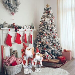 Dekoračná bielo červená figúrka Santa Clausa s batohom a lyžami 45 cm