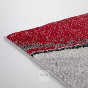 Dizajnový červený koberec s abstraktným vzorom