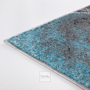 Dizajnový tyrkysový koberec s abstraktným vzorom